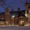 The historic Manor House at night during Deck the Hall.